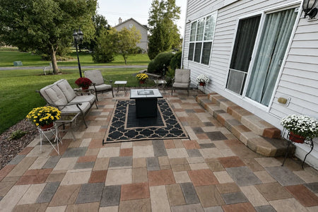 Finished ashlar-pattern stamped concrete patio in warm Auburn, Khaki, Terracotta, and Yukon Gold Antiquing stain