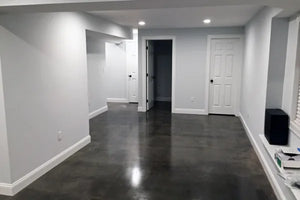 Fully transformed basement floor featuring the Charcoal AcquaTint™ sealer