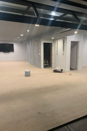 Concrete basement floor cleaned and prepped for staining