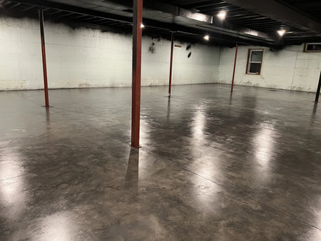 Image of the basement floor after the second coat of AquaTint