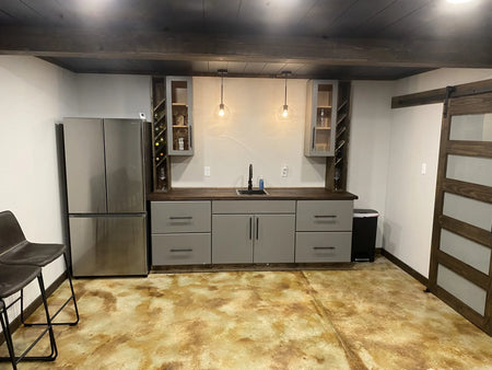 Basement floor acid stained with EverStain Malayan Buff Shifting Sand and Coffee Brown