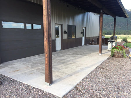 A bare outdoor space with unfinished concrete
