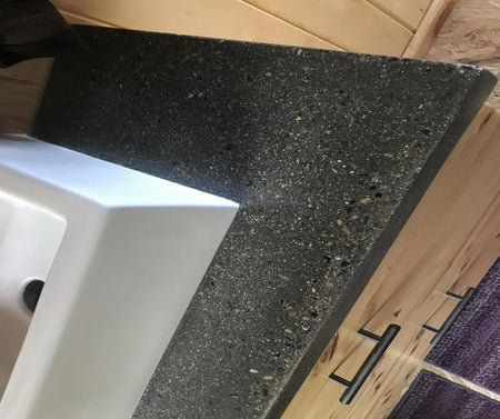 Integrally Colored Concrete Vanity with Smokestack Pigment and Stone Aggregate