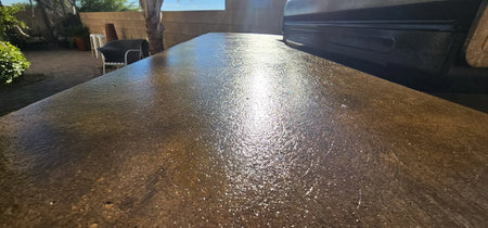 Finished countertop with a glossy marbled look using Cumin and Aztec brown stains