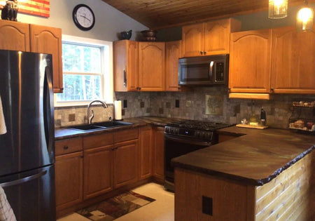 A finished concrete countertop, richly stained with a mix of Coffee Brown, Desert Amber, and Seagrass
