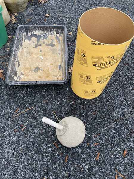 An array of materials and tools used for creating a DIY concrete fountain