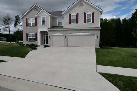 Broom-finished concrete driveway before applying Buff EasyTint colored sealer