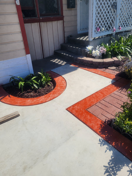 new concrete driveway with Crimson EasyTint stained border
