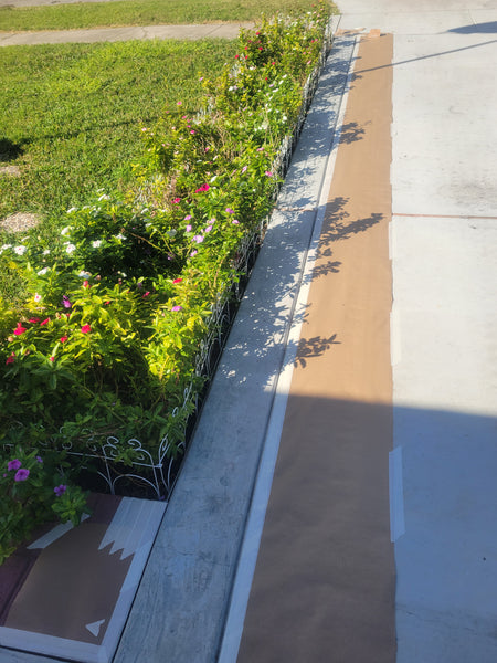 driveway edge taped off before Crimson EasyTint border