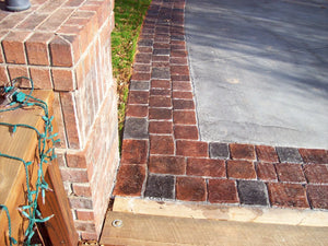 Milano Red and Charcoal Stained Concrete Paver Driveway