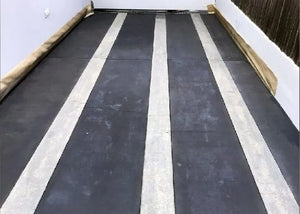 This is an image of a concrete driveway after the second coat of Stormy Gray Vibrance dye has been applied