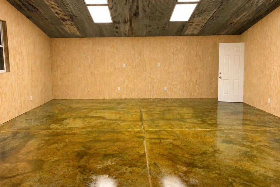 Malayan Buff and Avocado EverStain acid-stained concrete workshop floor with a marbled finish after neutralizing and sealing