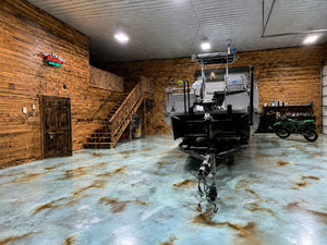 Azure Blue and Coffee Brown acid stained concrete floor in a boat storage garage