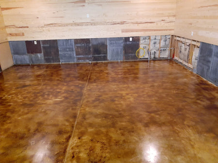 Drying coffee brown acid stain concrete garage floor after the application of high gloss EasySeal sealer