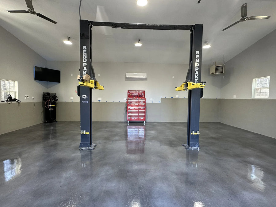 Finished garage floor with a sleek polished look using charcoal stormy gray white Vibrance dye and polyaspartic clear coat