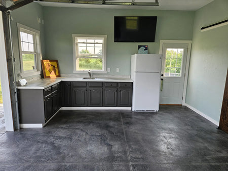 View of the finished garage highlighting the installed kitchen countertops