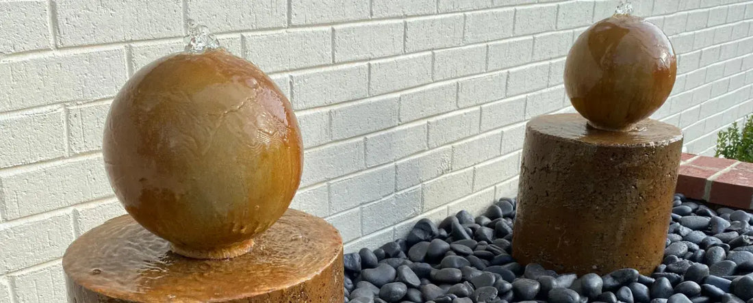 Acid stained concrete water fountain in a garden setting