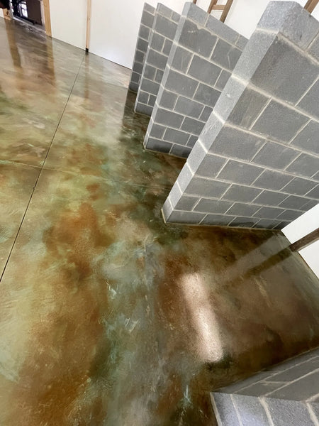 A vibrant green marbleized floor surrounding the designated stall areas for dogs
