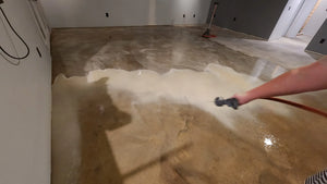 Spraying citrus etch residue into one area to be shop vacuumed up, after thoroughly neutralized and scrubbed