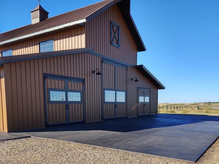 Rural barn with a broom-finished concrete apron transformed with Charcoal Antiquing Stain