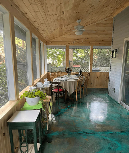 Sunroom concrete floor stained with Azure Blue, English Red, and Seagrass EverStain acid stains, then accented with acrylic paints