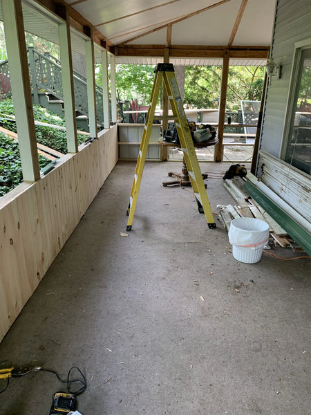 Old carpeted porch before the transformation process