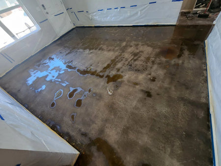 neautralized everstain black acid stained concrete floor carpet removal