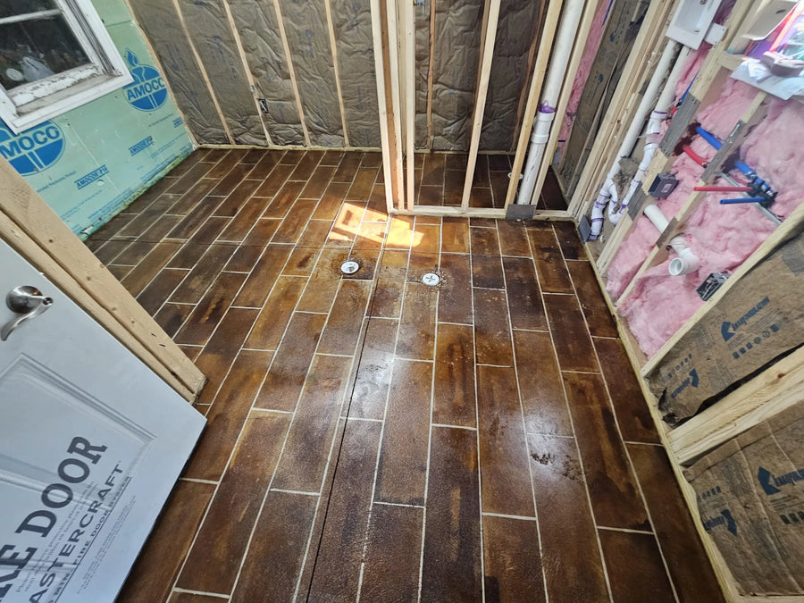 Final look of the faux-tile floor after applying two layers of sealer, showcasing its glossy finish