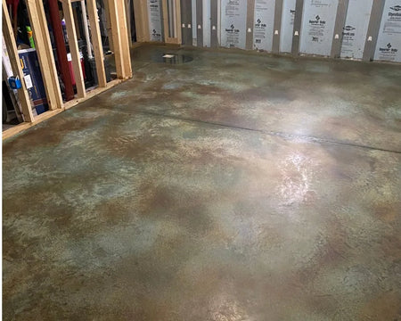Concrete floor thoroughly dry and neutralized, prepped for the application of sealer