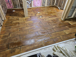 Freshly stained concrete floor in tile design, awaiting to dry