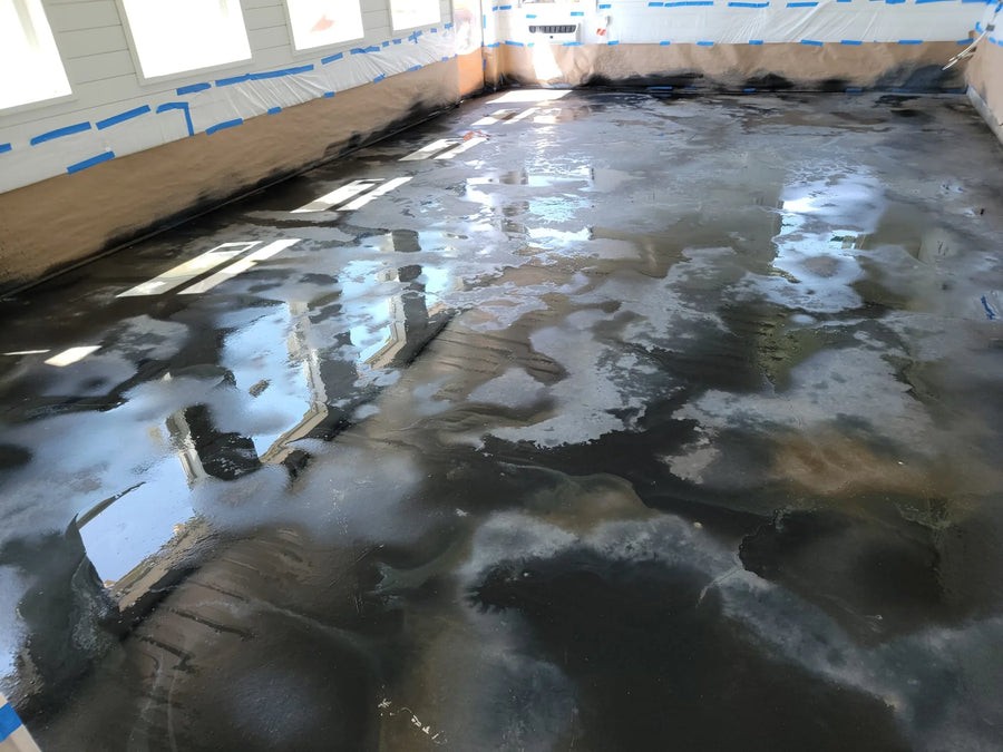 ColorWave Stains in Black, Stone, and Iron Gray Applied Using Puddling Method on Concrete Floor