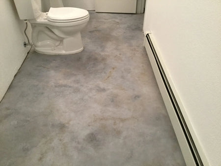 Dyed concrete bathroom floor