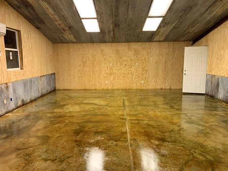 A final shot of a sealed concrete floor, revealing the Avocado and Malayan Bluff stain's enhanced colors after the application of a high-gloss sealer