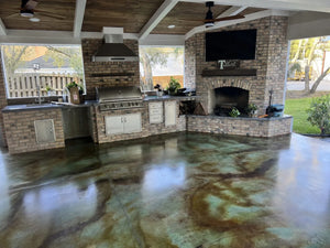 Malayan Buff and Seagrass acid stained concrete floor in a covered outdoor kitchen