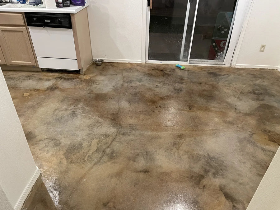 A photo showcasing the finished kitchen floor displaying a unique, worn leather look after the application of the acid stain