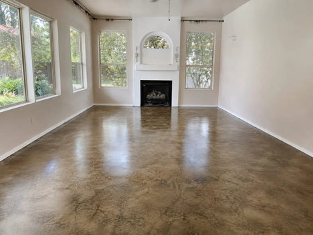 Finished living room with glossy mottled brown ColorWave Stone stained concrete floor sealed with AcquaSeal Satin and ProWax Polish Satin