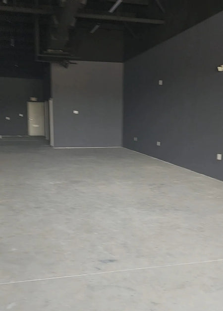 Unfinished concrete floor in a salon waiting for transformation