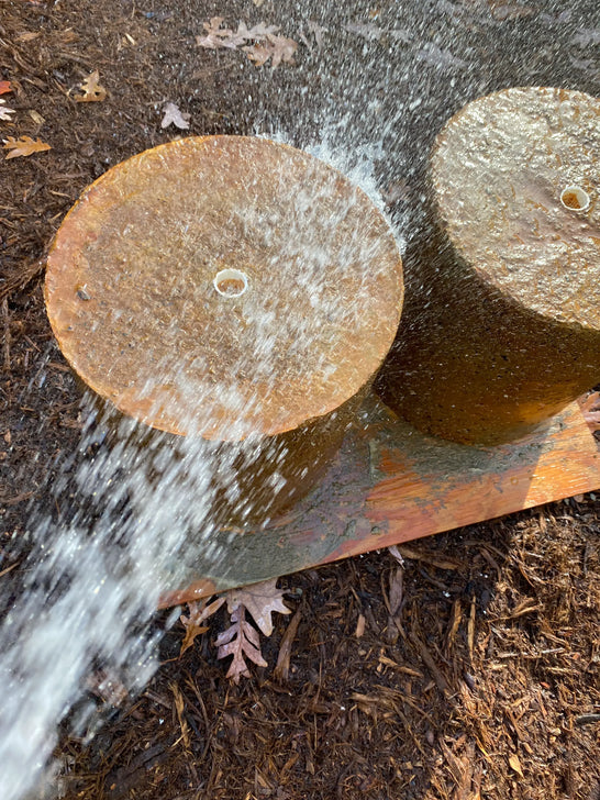 Rinsing a neutralized acid stained concrete fountain