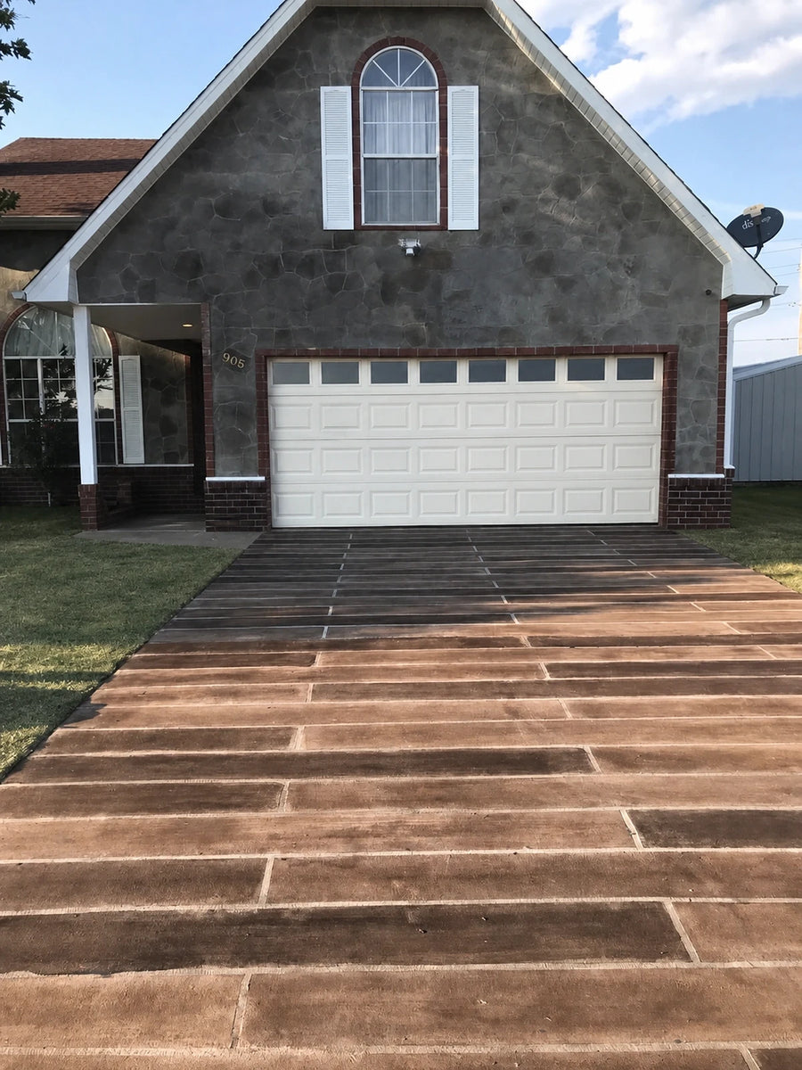 Concrete driveway with a tape-stencil wood-plank overlay stained with Driftwood and Aztec Brown Antiquing stain