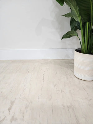 Artistic woodgrain effect using integrally colored cement overlay