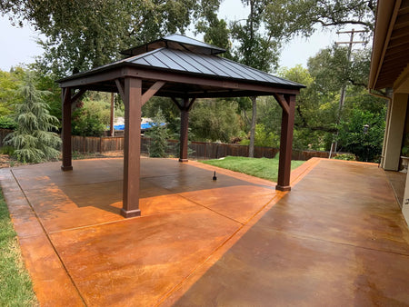 Broom-finish concrete patio and gazebo floor transformed with Cola EverStain Acid Stain
