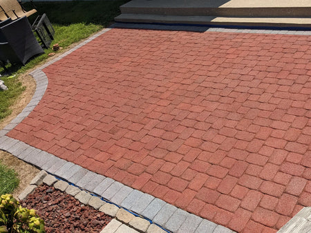 Fifteen-year-old concrete paver patio restored with Crimson Portico Stain and an Eagle Gray border