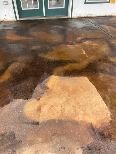 Covered concrete patio after Coffee Brown, Malayan Buff, and Desert Amber acid after stain application, during sealing