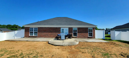 extended patio area before the transformation, showcasing the original, untreated concrete surface, awaiting the application of EasyTint Gray stain