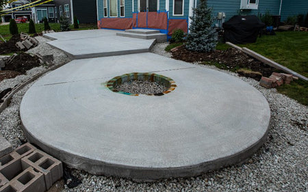 Acid stain color testing on small area of patio before staining entire surface