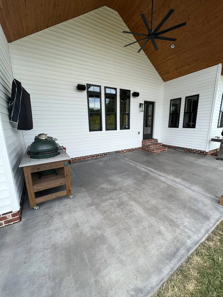 Image displaying the concrete covered patio post-application of Silver Gray Antiquing stain, showcasing the dramatic transformation and enhanced aesthetic of the surface