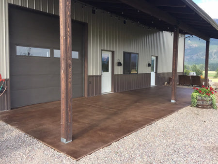 Smooth pole barn concrete patio transformed with rich brown Driftwood Antiquing Stain