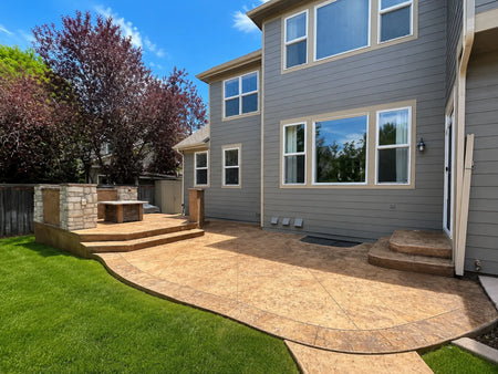 Restored backyard stamped concrete patio finished with Café Royale Antiquing Stain
