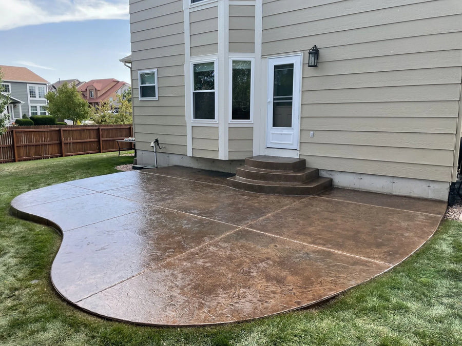 Revitalized integrally colored stamped concrete patio after application of Driftwood Antiquing Stain
