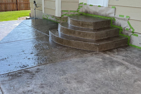 Faded integrally colored stamped concrete patio before the application of Antiquing™ Stain